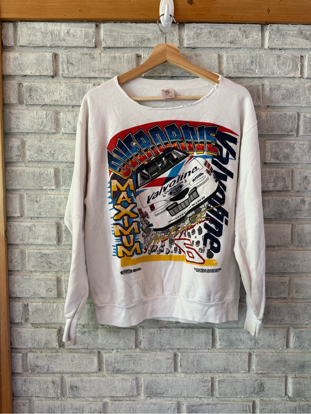 Delta Cream Sweatshirt Tag with Red and Blue Logo